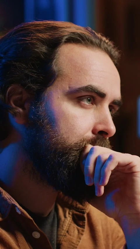 Software engineer puzzled in front of computer screen while writing complex code Stock Footage 264512420