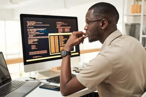 Software Engineer Reading Programming Code Foto stock
