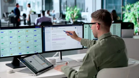 Software Engineer Reviews AI Knowledge Base On Convertible Laptop Stock Footage 340996834