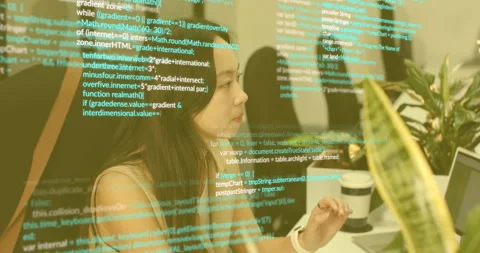 Software engineer settling at desk scanning code overlay appearing on laptop Stock Footage 315505722