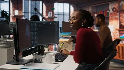 Software engineer solving tasks with AI LLM chatbot answering prompts Stock Photos