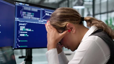 Software Engineer Struggles With Migraine While Coding Late Video stock 341001241