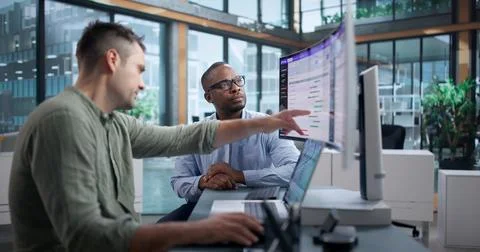Software Engineer Studies Split Test Data To Improve Website Performance. Stock Photos
