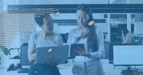 Software engineer tapping tablet, invoking code overlay while peer pointing line Stock Footage 318091668