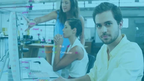 Software engineer typing code and activating security overlays while colleagues Stock Footage 310428324