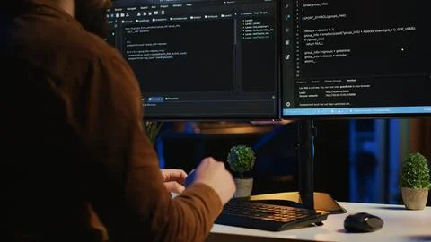 Software engineer typing on keyboard buttons, writing lines of code, close up 스톡 사진