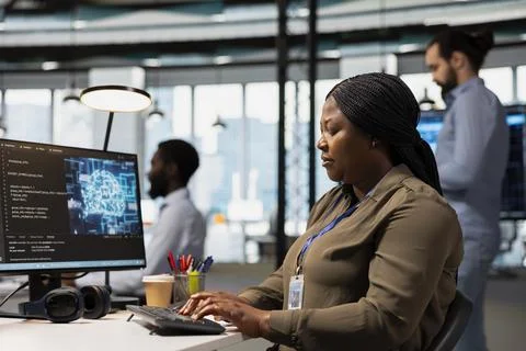 Software engineer using AI automation in tech workspace Foto stock