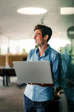 Software engineer using laptop computer with global network connection Foto stock
