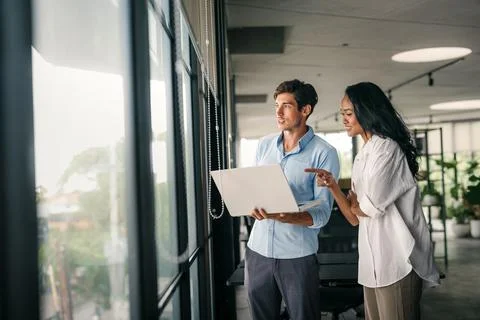 Software engineer using laptop computer with global network connection Stock Photos