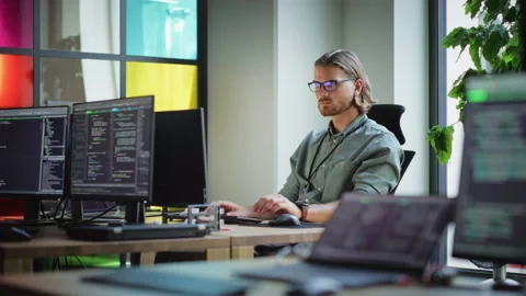 Software Engineer Working On Application In Office 動画素材 223192710