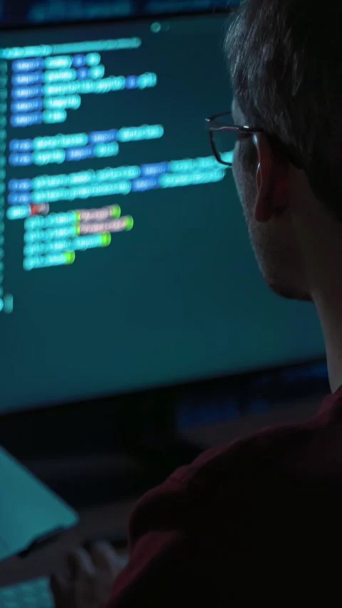 Software engineer working late at night on artificial intelligence project Stock Footage 345446273