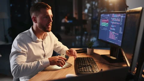 Software engineer working on a project by using programming language Stock Footage 301632497