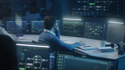 Software engineer works at computer late night Stock Footage 244411057