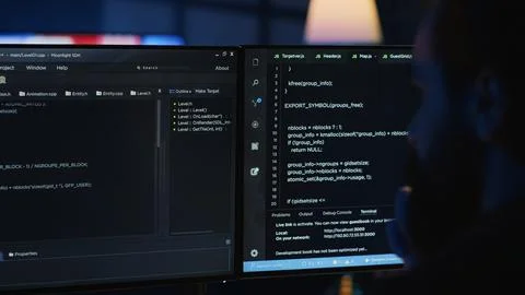 Software engineer writes complex binary code scripts on computer Stock Photos