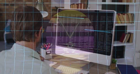 Software engineer writing notes at wooden desk in technology office, with Stock Footage 307428840