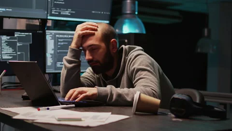 Software engineer yawning and falling asleep on desk Stock-Footage 222841606