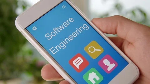 Software engineering concept application on the smartphone. Man uses mobile app. Stock Footage 77410411