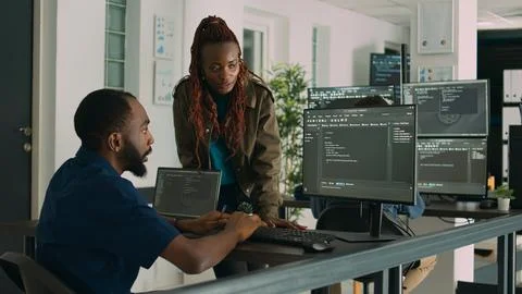 Software engineers brainstorming ideas to develop it code on computer Stock Photos