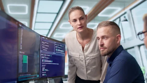 Software Engineers Collaborate Closely On Coding Secure Business Applications 動画素材 336790468