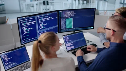 Software Engineers Collaborate Closely At Desk Stock Footage 338169138