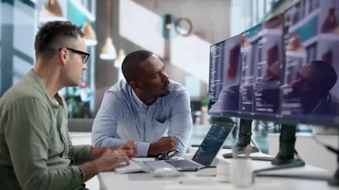 Software Engineers Collaborate Closely To Develop Secure Code Stock Footage 345850916