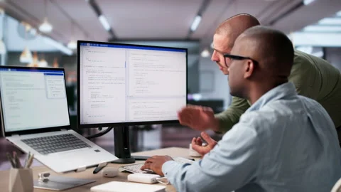 Software Engineers Collaborate Closely While Coding Secure Data Stock-Footage 335878758