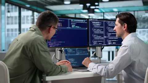 Software Engineers Collaborate At Desk, Coding Secure Algorithms Stock-Footage 347903456
