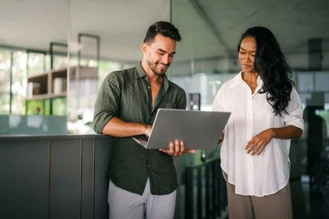 Software engineers using laptop computer with global network connection Stock Photos