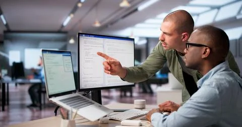 Software Engineers Work Together In Office Coding Secure Web Systems. Stock-Fotos
