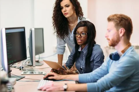 Software engineers working on project and programming in company Foto stock