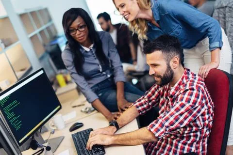 Software engineers working on project and programming in company Stock Photos