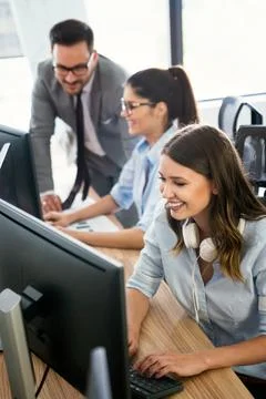 Software engineers working on project and programming in company Stock Photos