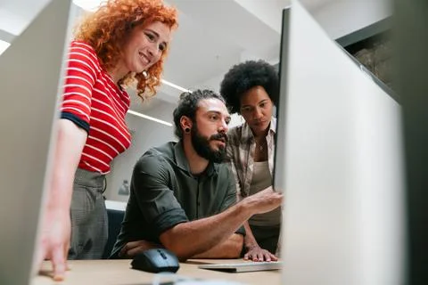 Software engineers working on project and programming in company Stock Photos