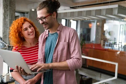 Software engineers working on project and programming in company Фото