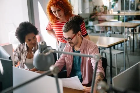 Software engineers working on project and programming in company. Startup b.. Stock Photos