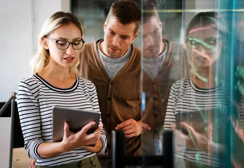 Software engineers working on project and programming in company. Business Stock Photos