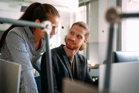 Software engineers working together on project at tech startup. Business Foto stock