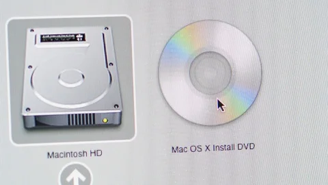 Software installation of Apple MacOS X DVD on iMac computers Stock Footage 103877763