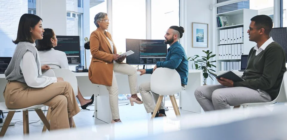 Software, mentor and programmer with business people in office for coding Stock Photos