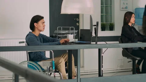 Software programer with physical disability writing code on computer Stock Footage 227614396