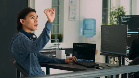 Software programer writing code and using holographic program with augmented Photos