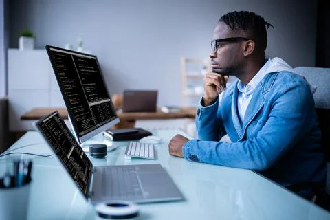 Software Programmer Coder Working On Computer Stock Photos