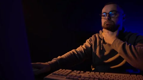Software Programmer in Front of Computer Screen From 1990's Working in Dark Room Stock Footage 301278344