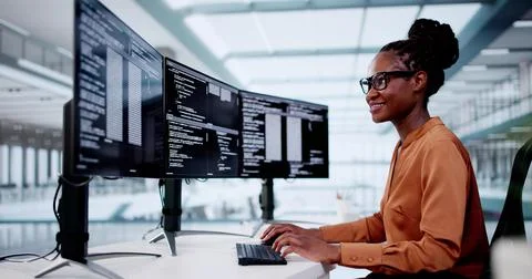 Software Programmer Or Coder Woman Using Office Computer Stock Photos