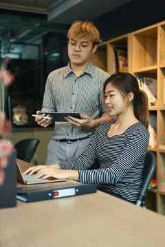 Software programmer team brainstorming, collaborating on compiling algorithm at 写真素材