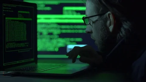 Software programmer works at night, selective focus on face Video stock 71220830