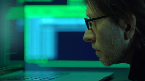 Software programmer works at night, selective focus on face Video stock 71222014