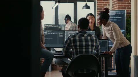 Software programmers discussing about online cloud computing while the rest of Stock Footage 168250810