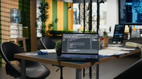 Software running on laptop in empty office to accelerate calculations Stock Photos