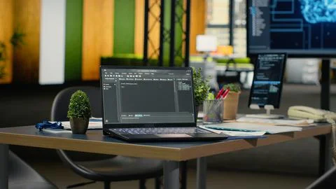 Software running on laptop in empty office to accelerate calculations Stock Photos